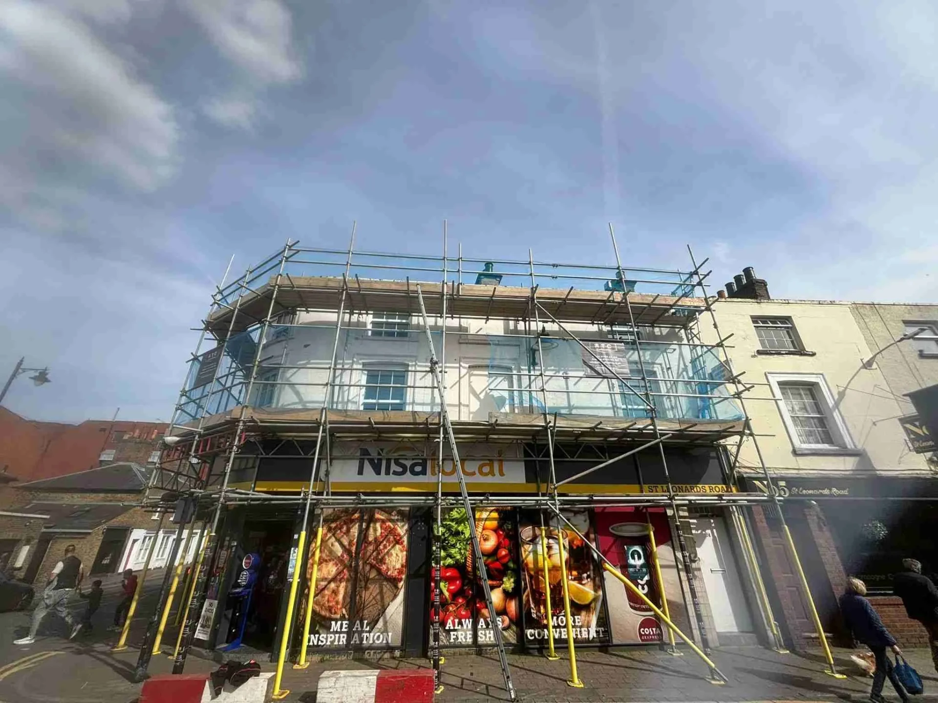 Commercial scaffolding erected by ATC Scaffolding on a shop and office building