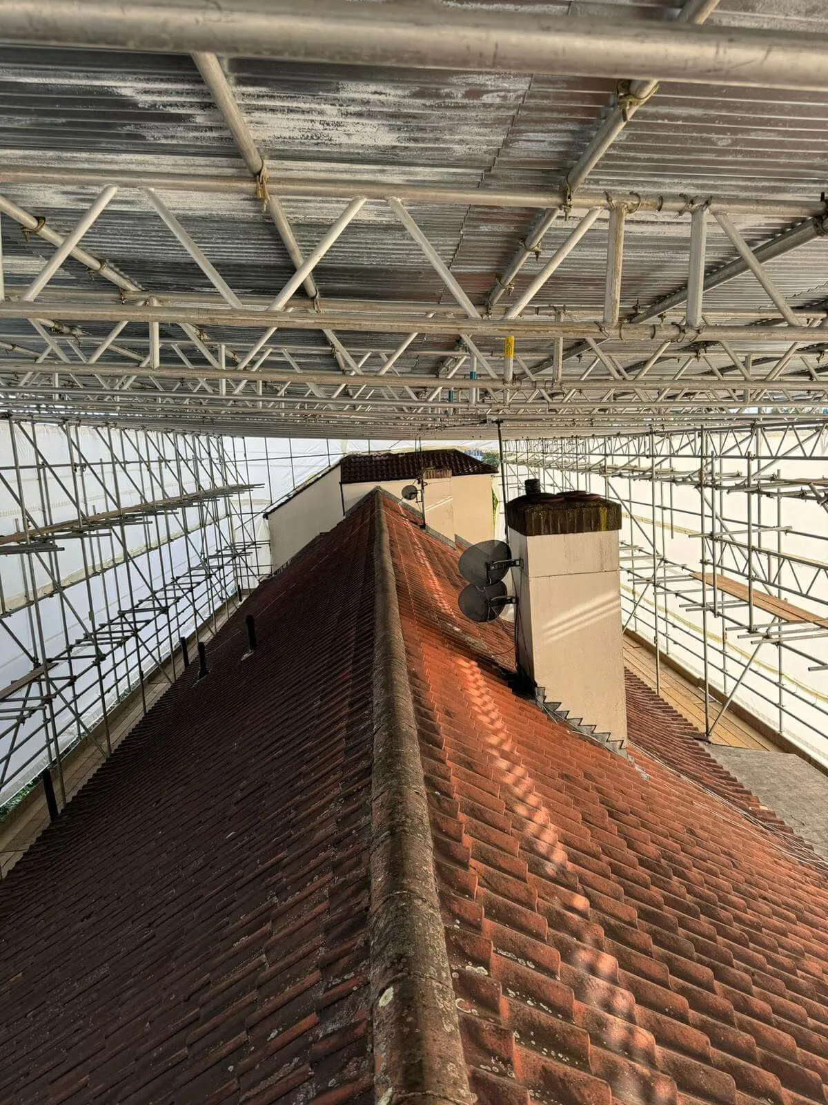 Fully sheeted temporary roof scaffolding erected by ATC Scaffolding over a property