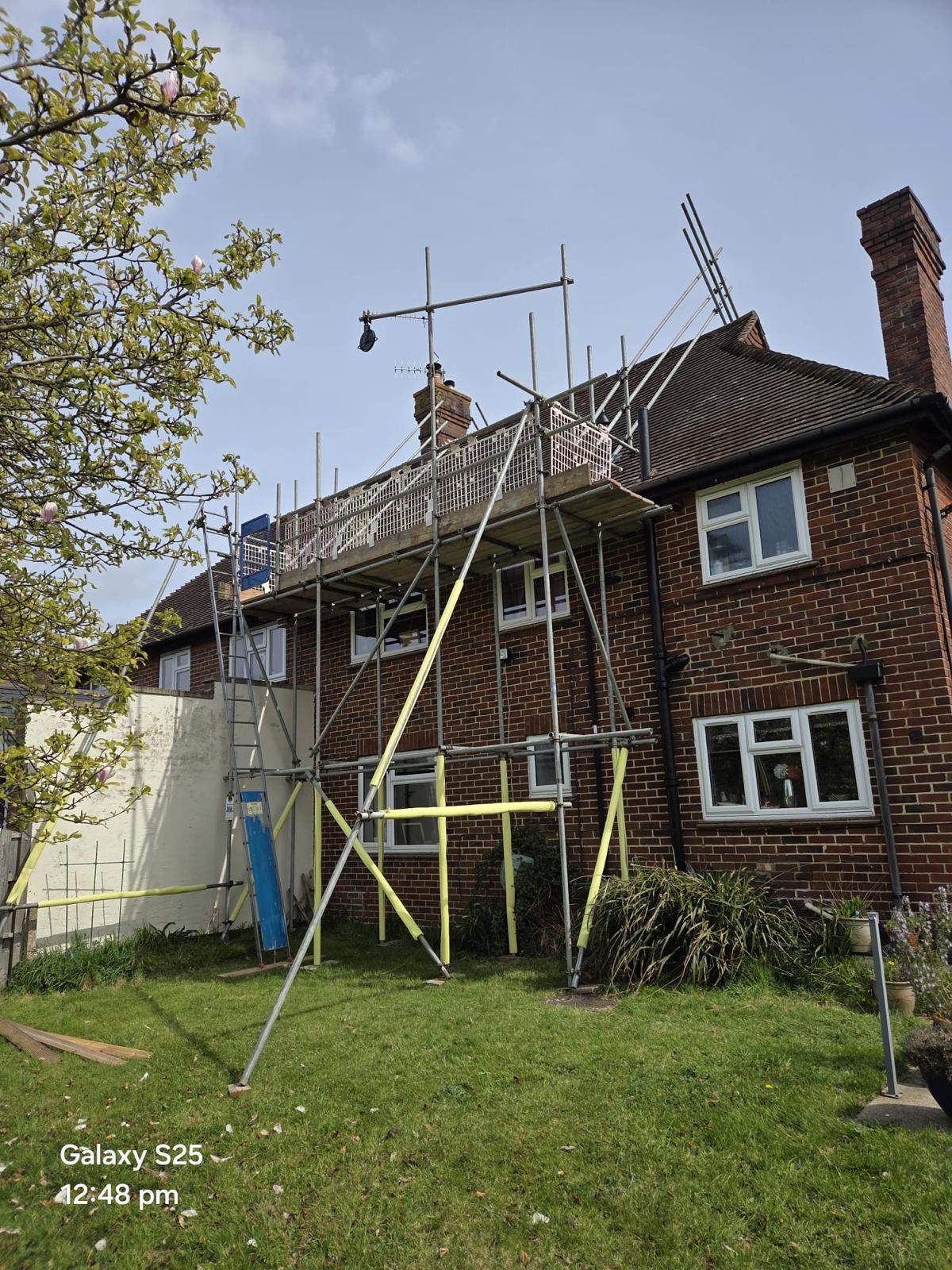 Domestic scaffolding erected by ATC Scaffolding around a house for roofing and exterior works