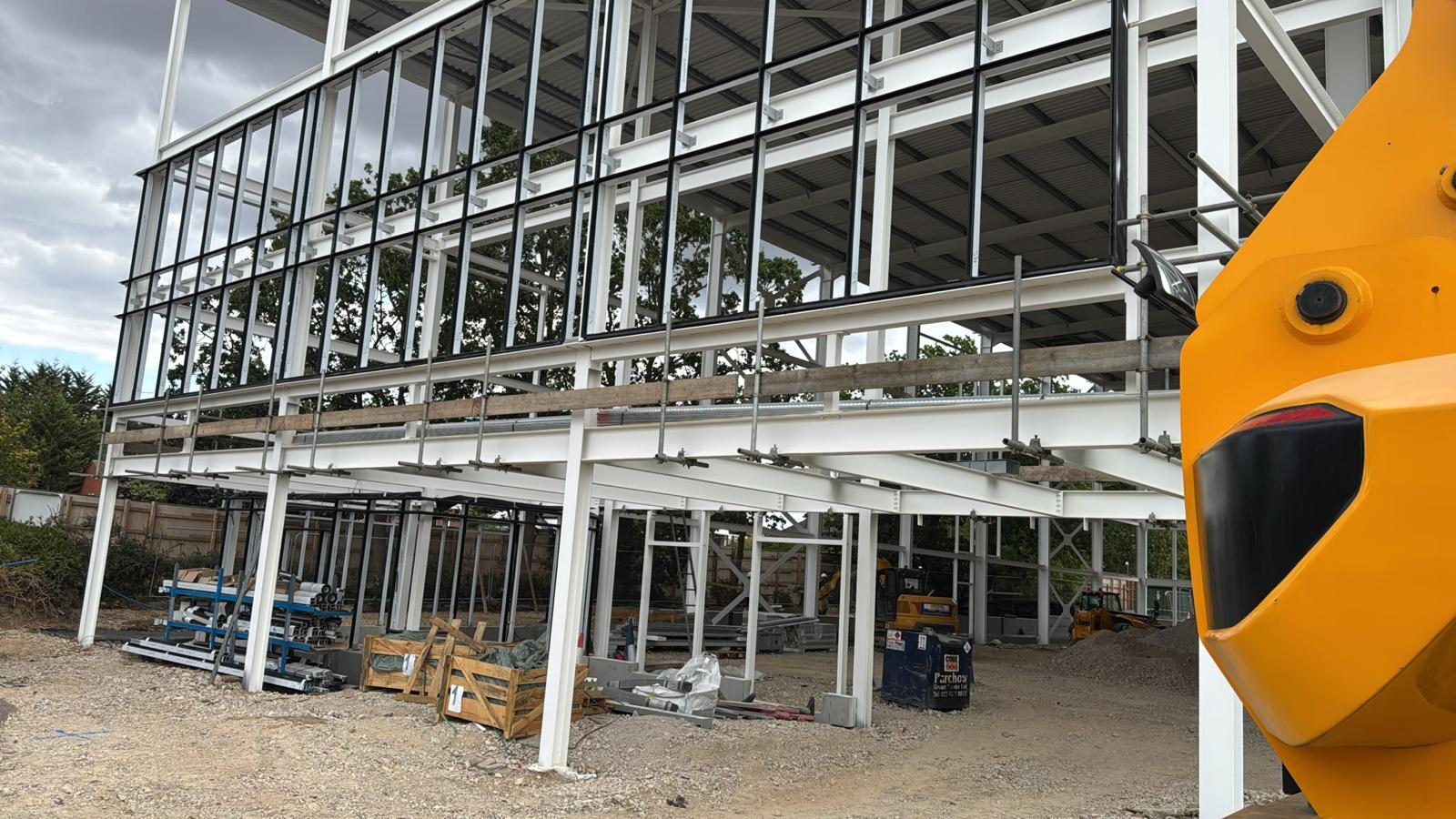 Perimeter edge protection guardrails installed around a steel-frame commercial building by ATC Scaffolding