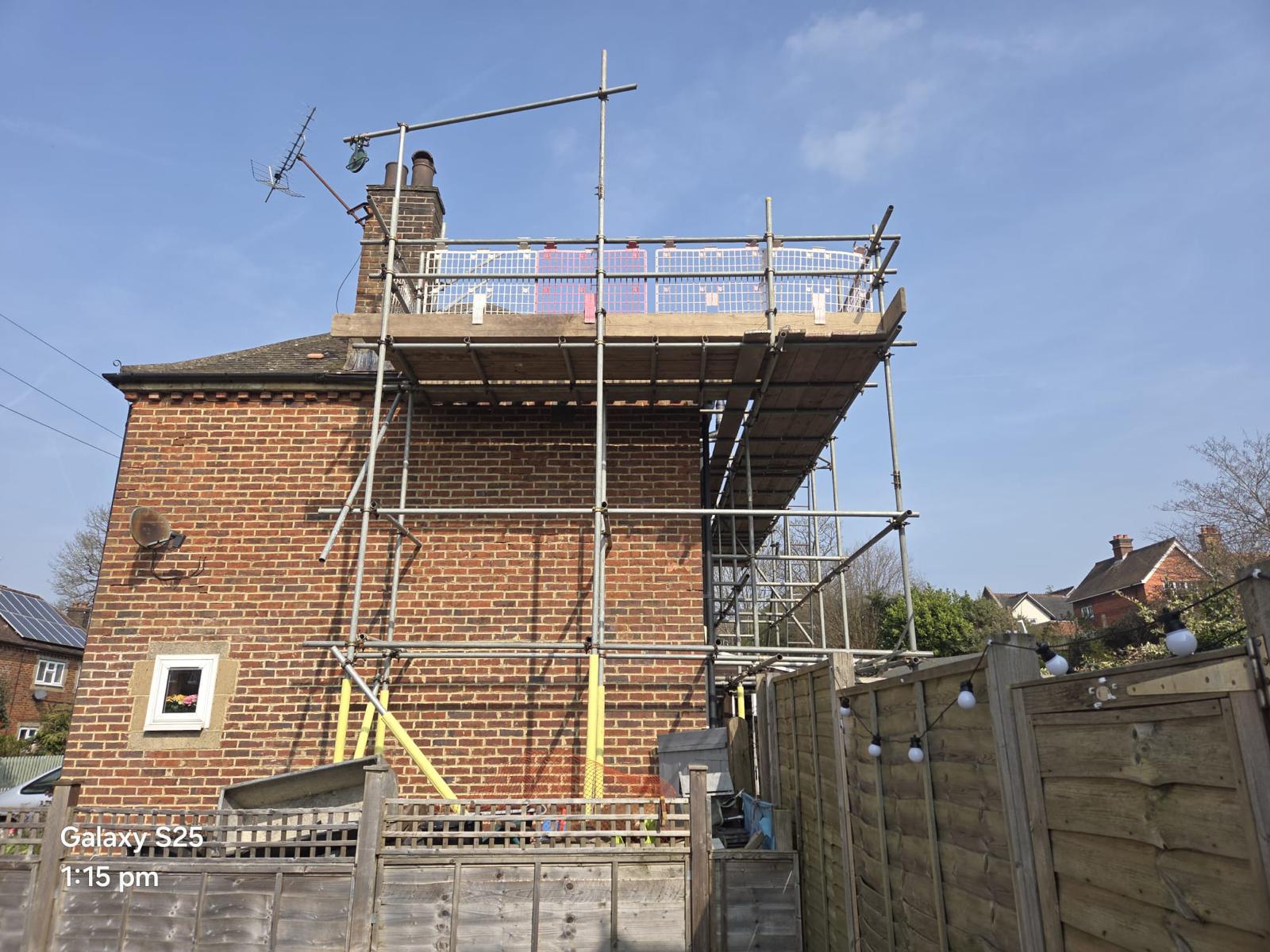Domestic scaffolding erected by ATC Scaffolding around a house for roofing and exterior works
