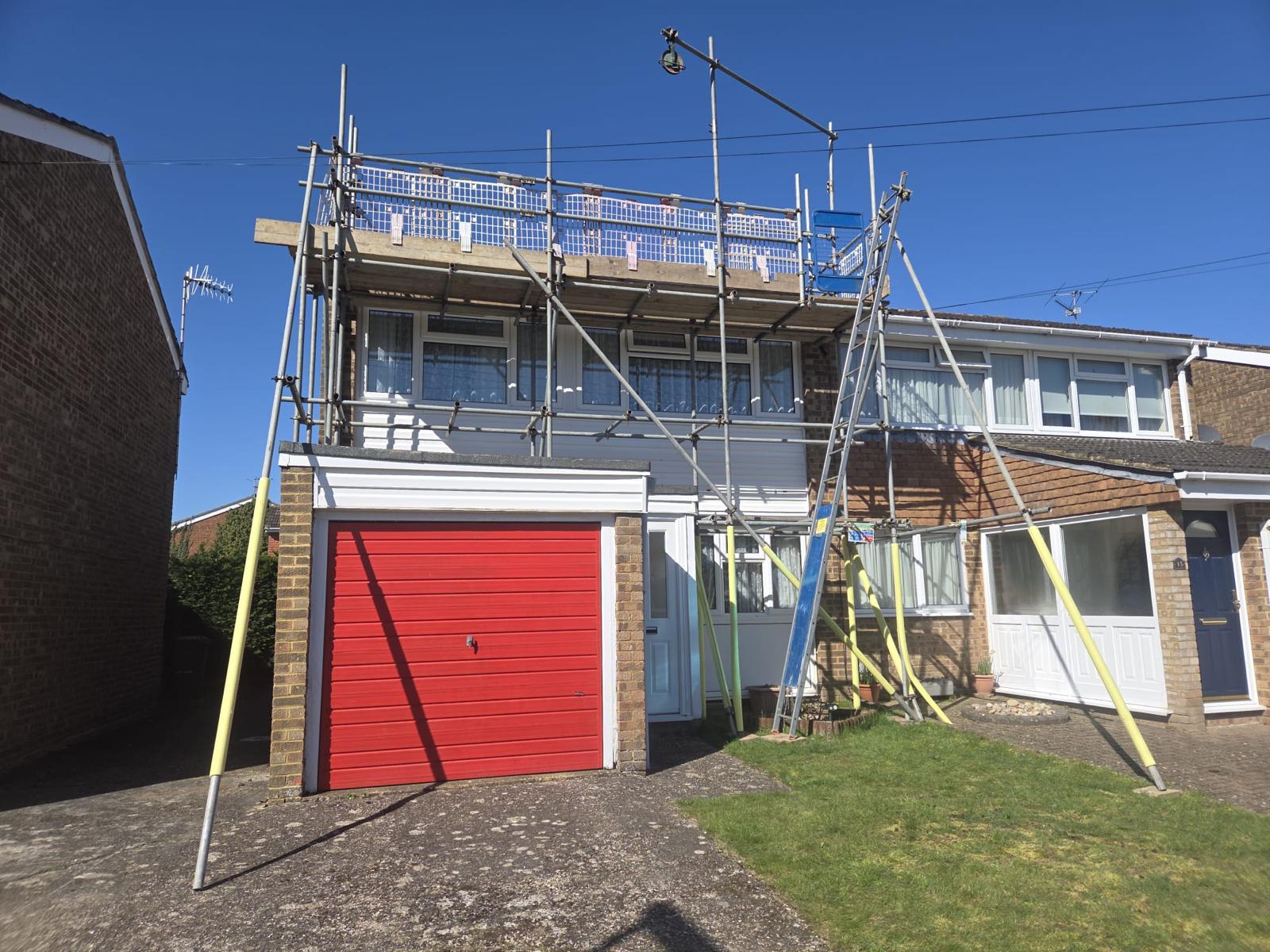 Domestic scaffolding erected by ATC Scaffolding around a house for roofing and exterior works
