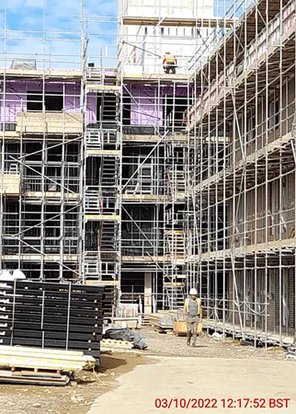 Scaffolding and staircase access supporting works between two blocks of a multi-storey development